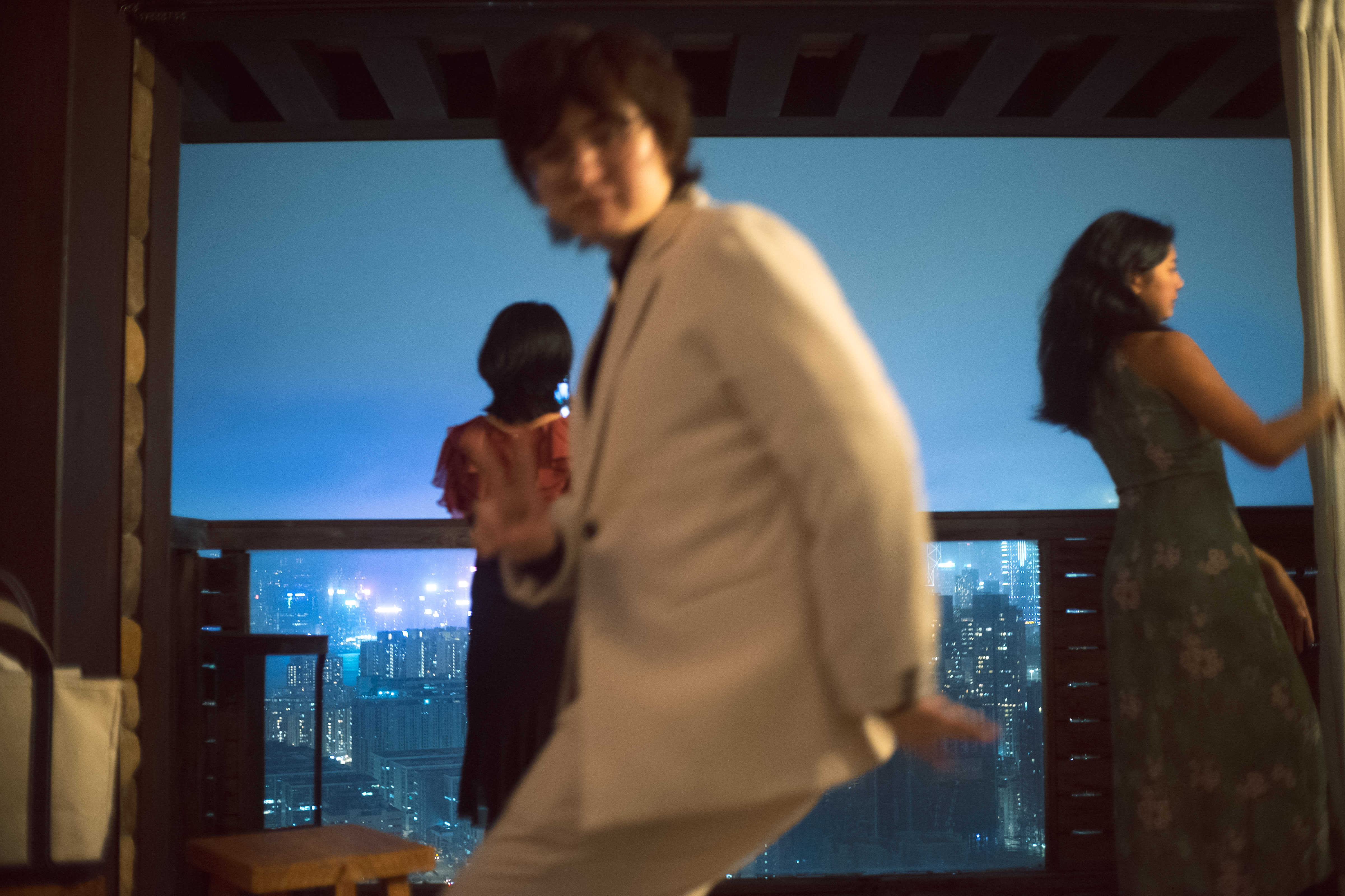 A couple dancing in front of a city skyline