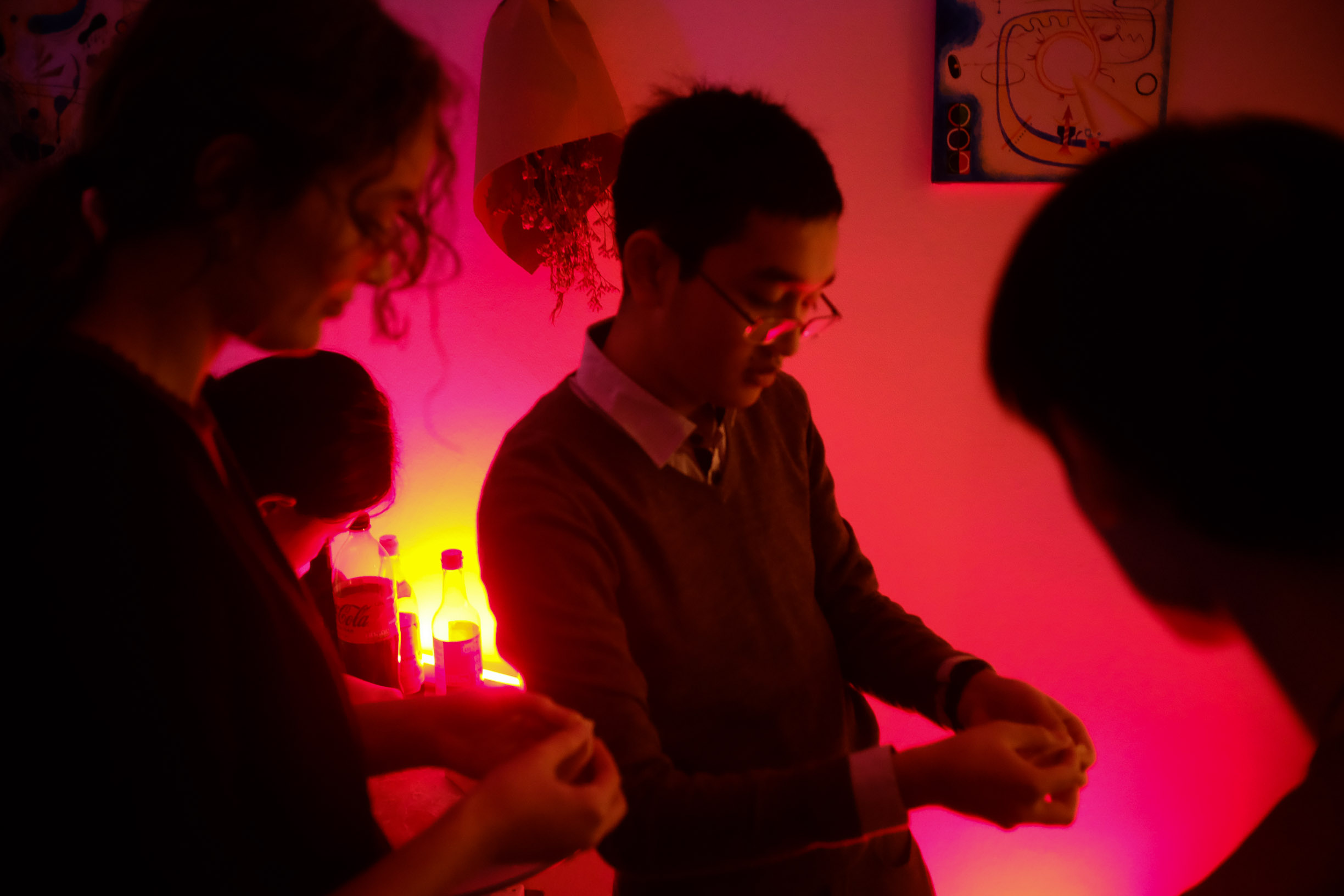 Friends gathered in red party light