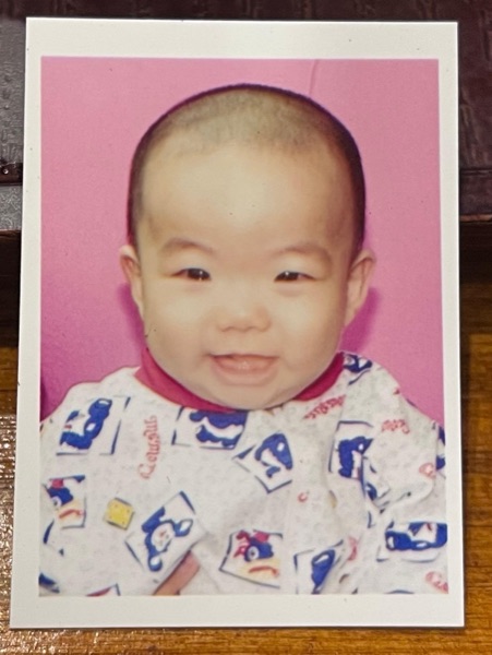 A passport photo of Lok Wa